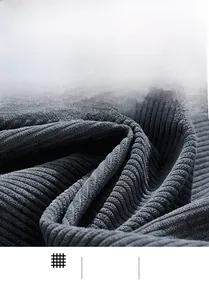 Close-up of deep grey-blue ribbed corduroy fabric showing thick and soft texture
