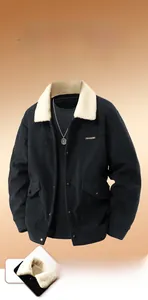 Close-up of black corduroy jacket with thick beige fleece collar and utility button pockets