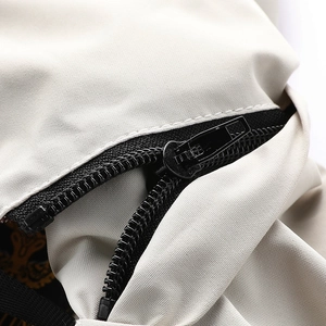 Close-up of black metallic zipper and high-density waterproof fabric on spring jacket