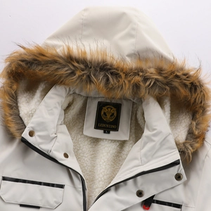 Close-up of the beige parka showing faux fur collar and warm fleece lining detail