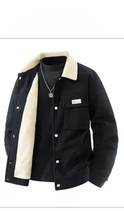 Close-up of black corduroy jacket with white fleece lining and utility chest pocket