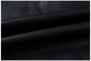 Close-up macro shot of premium black faux leather texture with fine lychee grain details