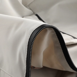 Close-up of windproof fabric texture and black zipper detail on a men's winter jacket