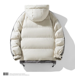 Detail of winter puffer jacket featuring drawstring hem and grey patchwork accents