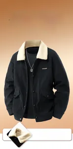 Detail of black corduroy jacket showing thick plush lining and soft white fur collar