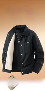 Detail shot of men's black jacket with classic check pattern and warm fleece lining