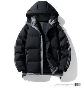 Close-up of black hooded puffer jacket showing zipper pockets and grey contrast stripes