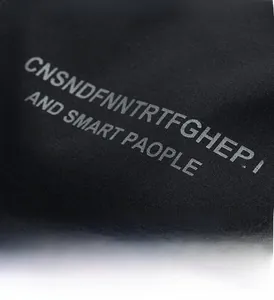 Detail of high-density black fabric showing white screen-printed street style letters