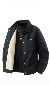 Close-up of black checkered jacket with warm cream faux fur lining and metal buttons