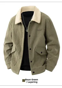 Detail of pea green corduroy jacket with white fleece collar and buttoned chest pockets