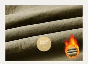 Close-up of thick thermal casual fabric showing textured fleece lining for winter warmth