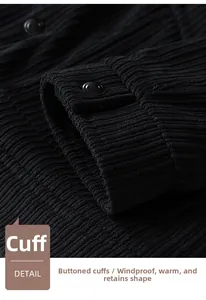 Detailed macro view of black corduroy jacket cuff with button and ribbed texture
