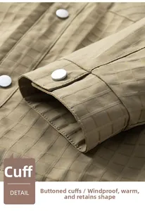 Macro detail of khaki plaid jacket cuff with premium matte silver metal snap button