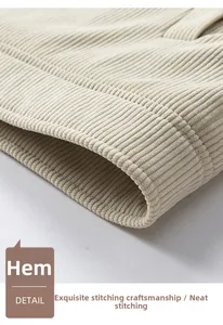 Close-up of beige corduroy hem detail with precise stitching on men's vintage jacket