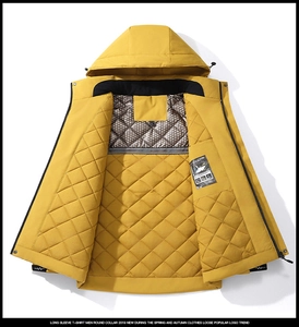 Detail view of the yellow padded jacket showing diamond quilted lining and inner pockets