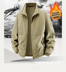 Detail of khaki outdoor jacket showing fleece lining, metal zipper and windproof fabric