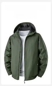 Detail of dark green windproof jacket with adjustable velcro cuffs and waterproof fabric