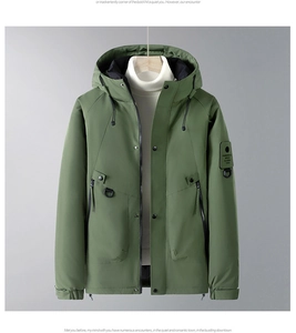 Detail of army green thermal parka with sleeve patch and drawstring hood structure