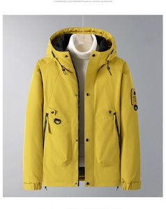 Detail of a bright yellow winter hooded parka featuring multi-pockets and windproof flap