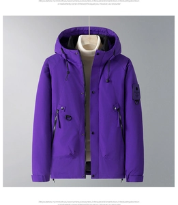 Detail of purple hooded winter jacket with drawstring hood and functional sleeve patch