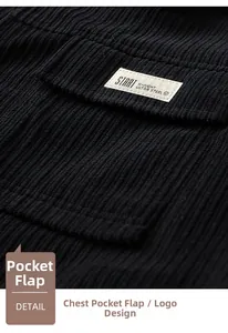 Close-up of black corduroy jacket pocket with woven label and textured ribbed fabric