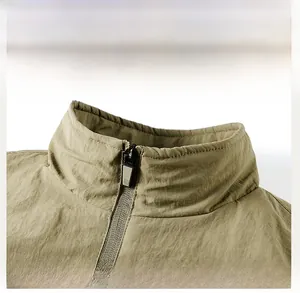 Detail of outdoor sport jacket stand collar with textured fabric and metallic zipper