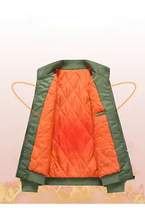 Detail of olive green jacket with orange quilted lining and thermal insulation