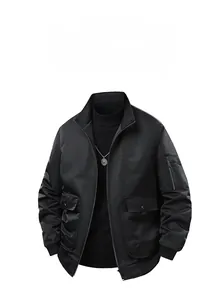 Detail view of black bomber jacket featuring stand collar and tactical utility sleeve pocket