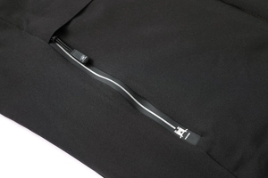 Detail of matte black waterproof zipper with STYLISH logo on hooded padded jacket