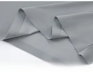 Detail of the grey breathable honeycomb fabric and seamless heat-sealed hemline technology