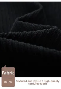 Macro shot showing the detailed vertical stripe texture of black corduroy jacket fabric