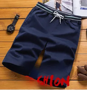 Detail of navy blue casual shorts with elastic drawstring waist and striped ribbon trim