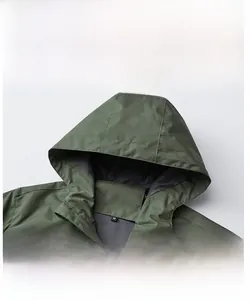 Macro detail of army green hooded windbreaker jacket with ripstop fabric texture