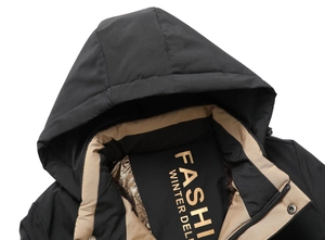 Detail of hooded winter jacket showing windproof fabric and thermal reflective lining