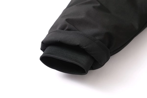 Macro detail of windproof ribbed cuffs on black winter hooded parka jacket for men