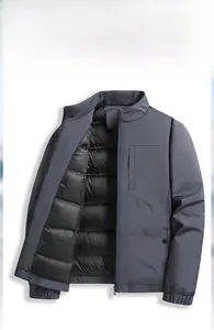 Close-up of dark grey men's stand-up collar down jacket with premium metal zipper detail