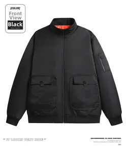 Detail of a black bomber jacket featuring windproof fabric and vibrant orange lining