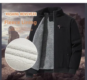 Close-up of men's black corduroy jacket showing thick grey fleece lining and chest zipper