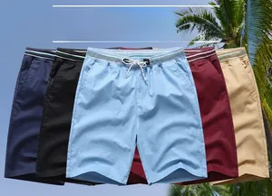 Detailed pile view of men's summer casual drawstring shorts in five different colors