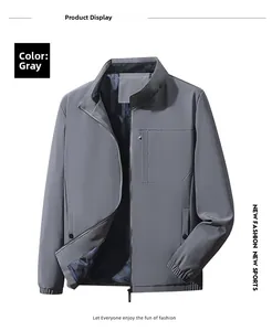 Detail of grey business jacket showing chest zipper pocket and elastic cuffs construction