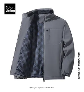 Detail of dark grey casual jacket showing vertical chest pocket and blue plaid lining