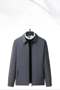 Close-up of a men's dark grey business casual jacket featuring a classic lapel and zip pockets
