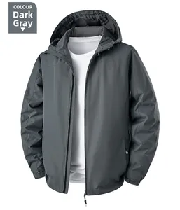 Detail view of dark grey hooded jacket with adjustable velcro cuffs and windproof fabric