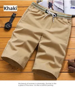 Detail of khaki men's cotton shorts showing elastic drawstring waist and side pockets