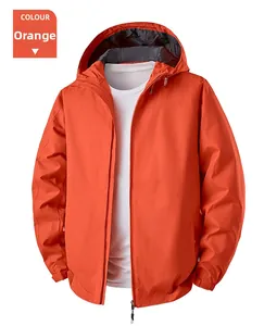 Detail view of water resistant orange hooded outdoor windbreaker with elastic cuffs