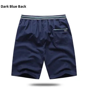 Detail view of navy casual shorts back side with elastic drawstring waist and striped pocket