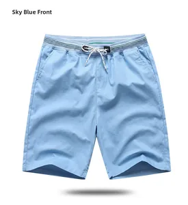 Detail of sky blue men's shorts with elastic waistband and green striped trim detail