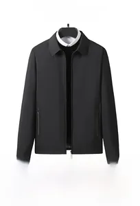 Detail of a men's business jacket showing turn-down collar and smooth zipper pockets