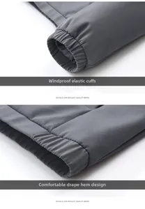 Detail view of windproof elastic cuffs and a straight hem on a dark grey men's jacket