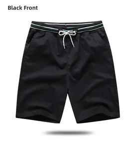Close-up of the elastic drawstring waistband on black casual summer sports shorts